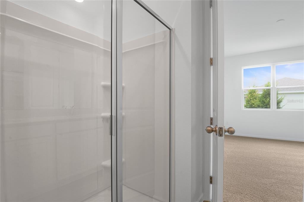 236 Flag Lilly Lane Umatilla, FL 32784 - Photo 16 of 25 a bathroom with a window