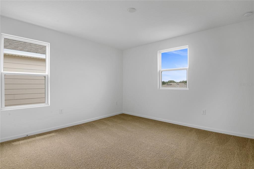 236 Flag Lilly Lane Umatilla, FL 32784 - Photo 17 of 25 an empty room with a window