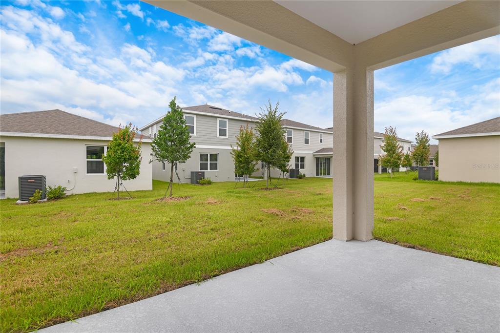 236 Flag Lilly Lane Umatilla, FL 32784 - Photo 19 of 25 a view of a house with a yard