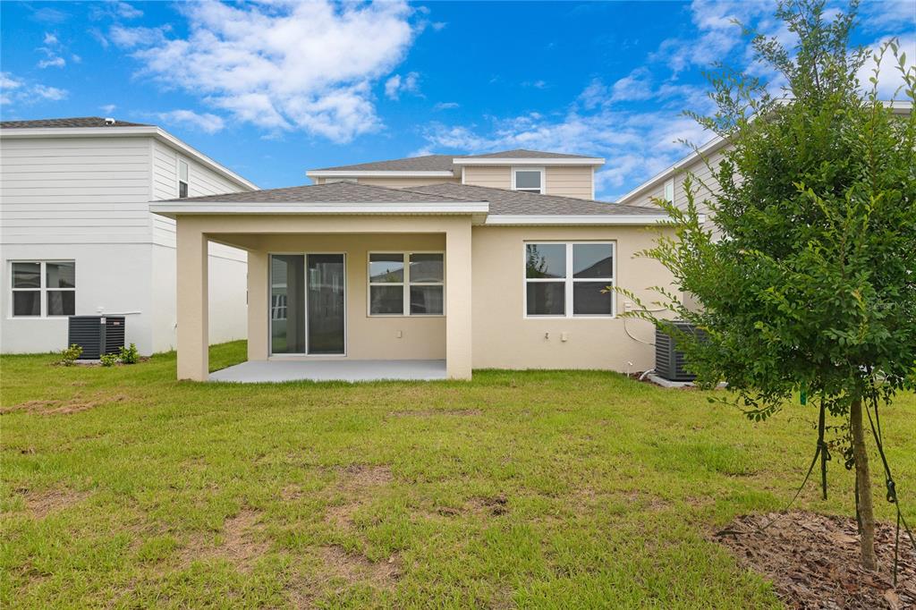 236 Flag Lilly Lane Umatilla, FL 32784 - Photo 20 of 25 a view of a house with a yard