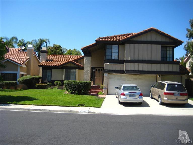 12491 Spring Creek Road Moorpark, CA 93021 - Photo 1 of 4 a car parked in front of a house