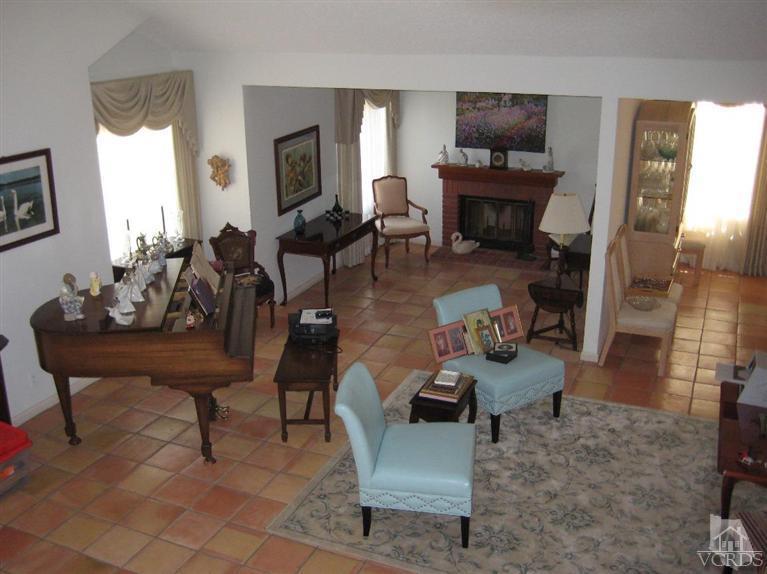 12491 Spring Creek Road Moorpark, CA 93021 - Photo 2 of 4 a living room with furniture and a fireplace