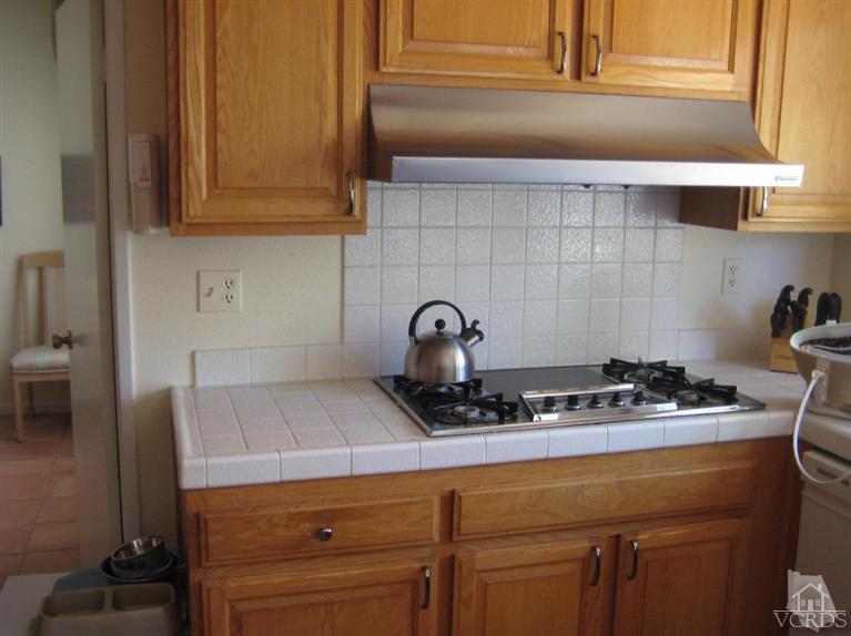 12491 Spring Creek Road Moorpark, CA 93021 - Photo 3 of 4 a kitchen with a sink and cabinets