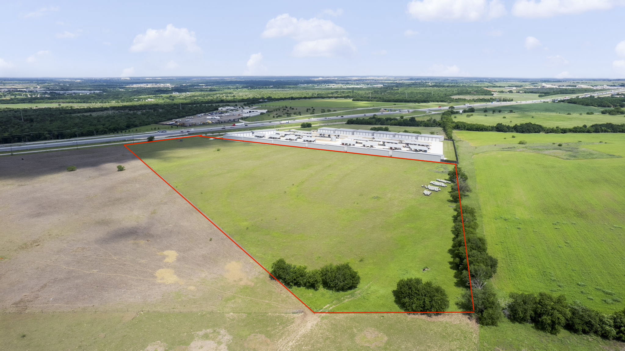 6100 Interstate 35 Georgetown, TX 78626 - Photo 2 of 11 Expansive undeveloped land featuring a mixture of green and brown fields