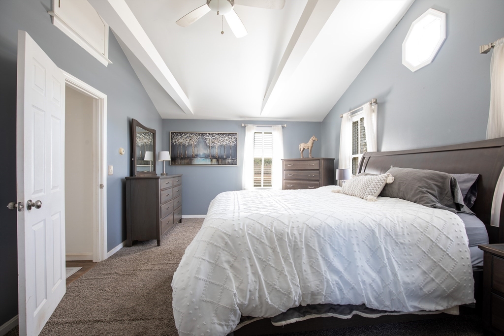 40 Pine Street Carver, MA 02330 - Photo 12 of 30 a bedroom with a bed and a large mirror