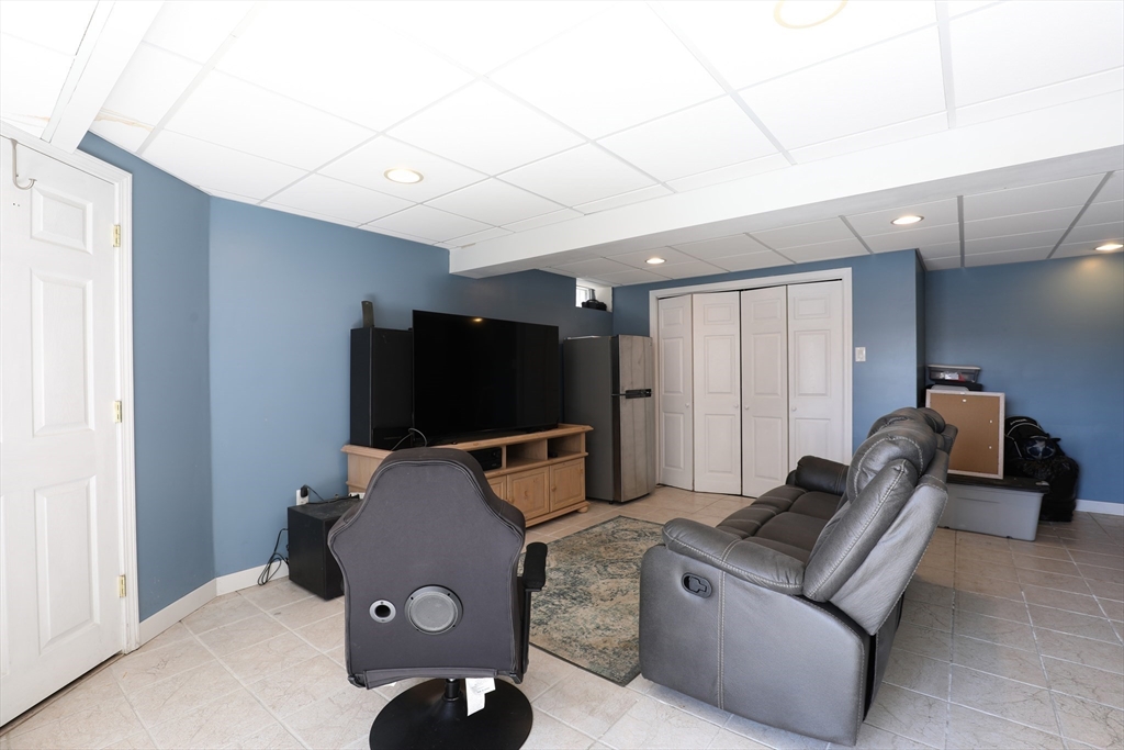 40 Pine Street Carver, MA 02330 - Photo 16 of 30 a living room with furniture and a flat screen tv