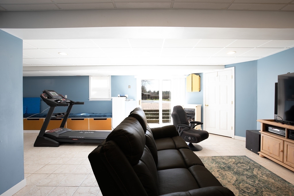 40 Pine Street Carver, MA 02330 - Photo 18 of 30 a living room with furniture and a flat screen tv