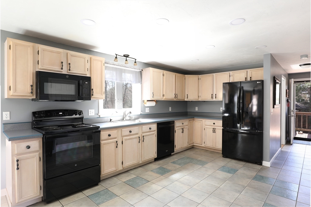 40 Pine Street Carver, MA 02330 - Photo 2 of 30 a kitchen with stainless steel appliances granite countertop a refrigerator and a stove top oven