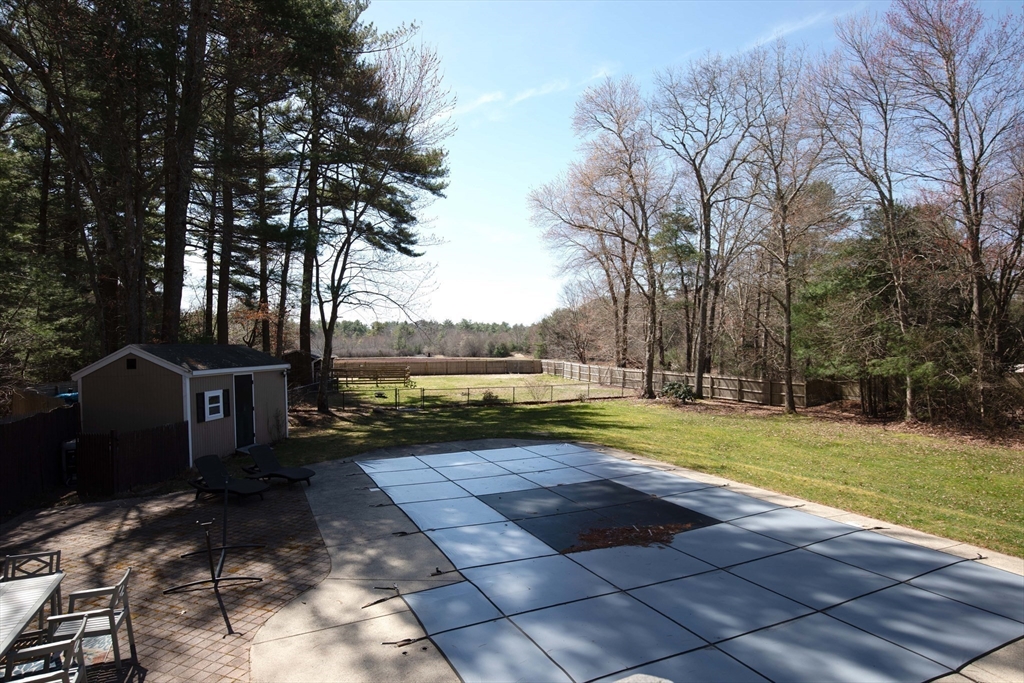 40 Pine Street Carver, MA 02330 - Photo 21 of 30 a view of a backyard with large trees