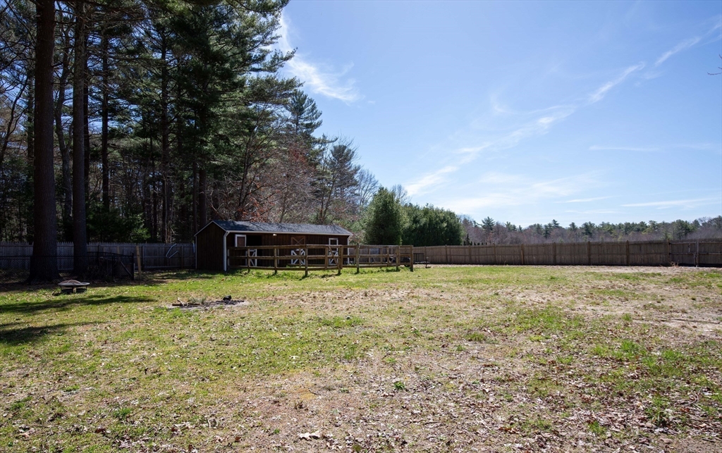 40 Pine Street Carver, MA 02330 - Photo 24 of 30 a backyard of a house with lots of green space