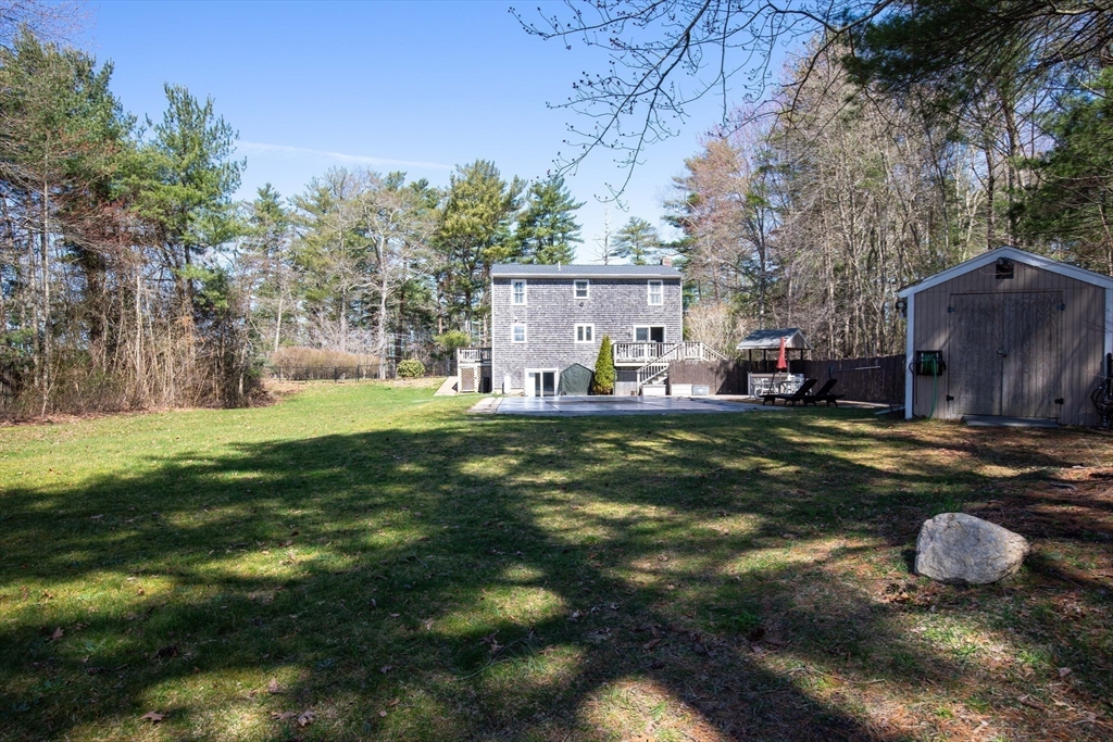 40 Pine Street Carver, MA 02330 - Photo 26 of 30 a view of a house with backyard and sitting area