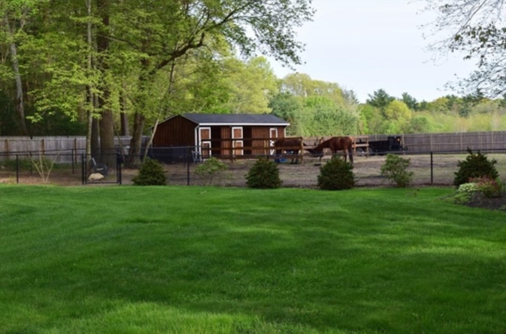 40 Pine Street Carver, MA 02330 - Photo 29 of 30 a view of a house with a yard and sitting area