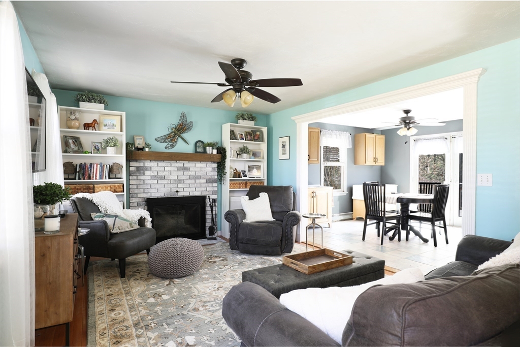 40 Pine Street Carver, MA 02330 - Photo 6 of 30 a living room with furniture and a fireplace