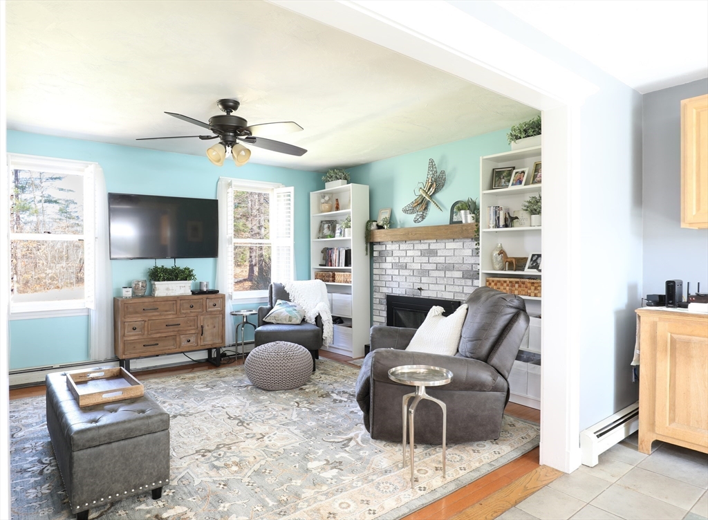40 Pine Street Carver, MA 02330 - Photo 7 of 30 a living room with furniture and a flat screen tv