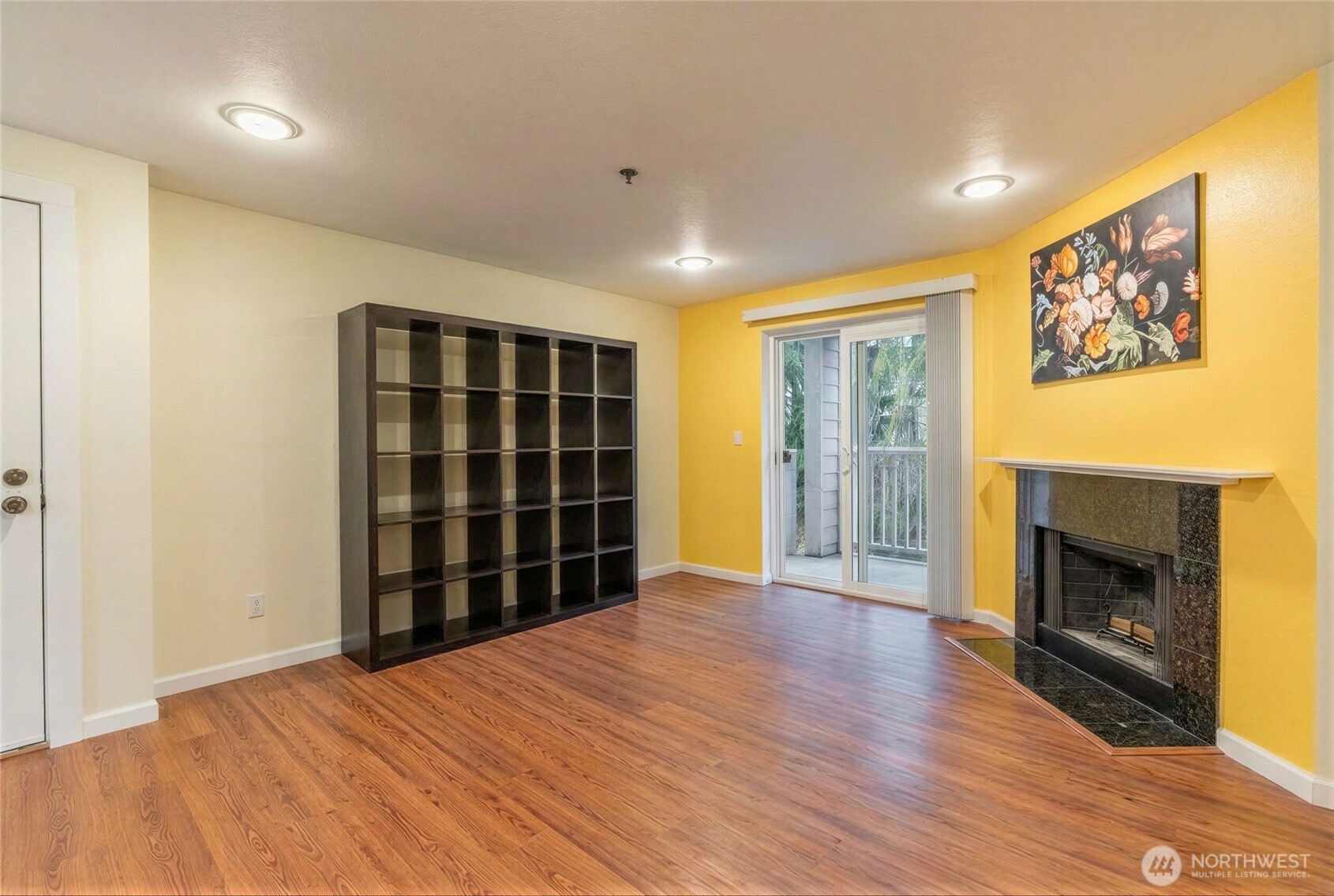 975 Aberdeen Avenue Northeast, Unit F207 Renton, WA 98056 - Photo 4 of 24 a view of an empty room with a fireplace and a window