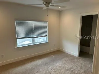 a white bath tub sitting next to a white toilet