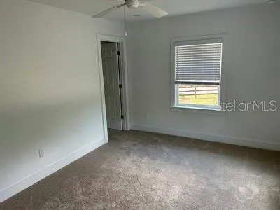 a bathroom with a toilet and a bathtub
