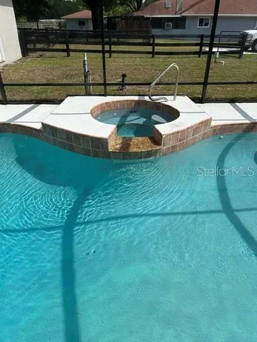 a backyard of a house with outdoor seating