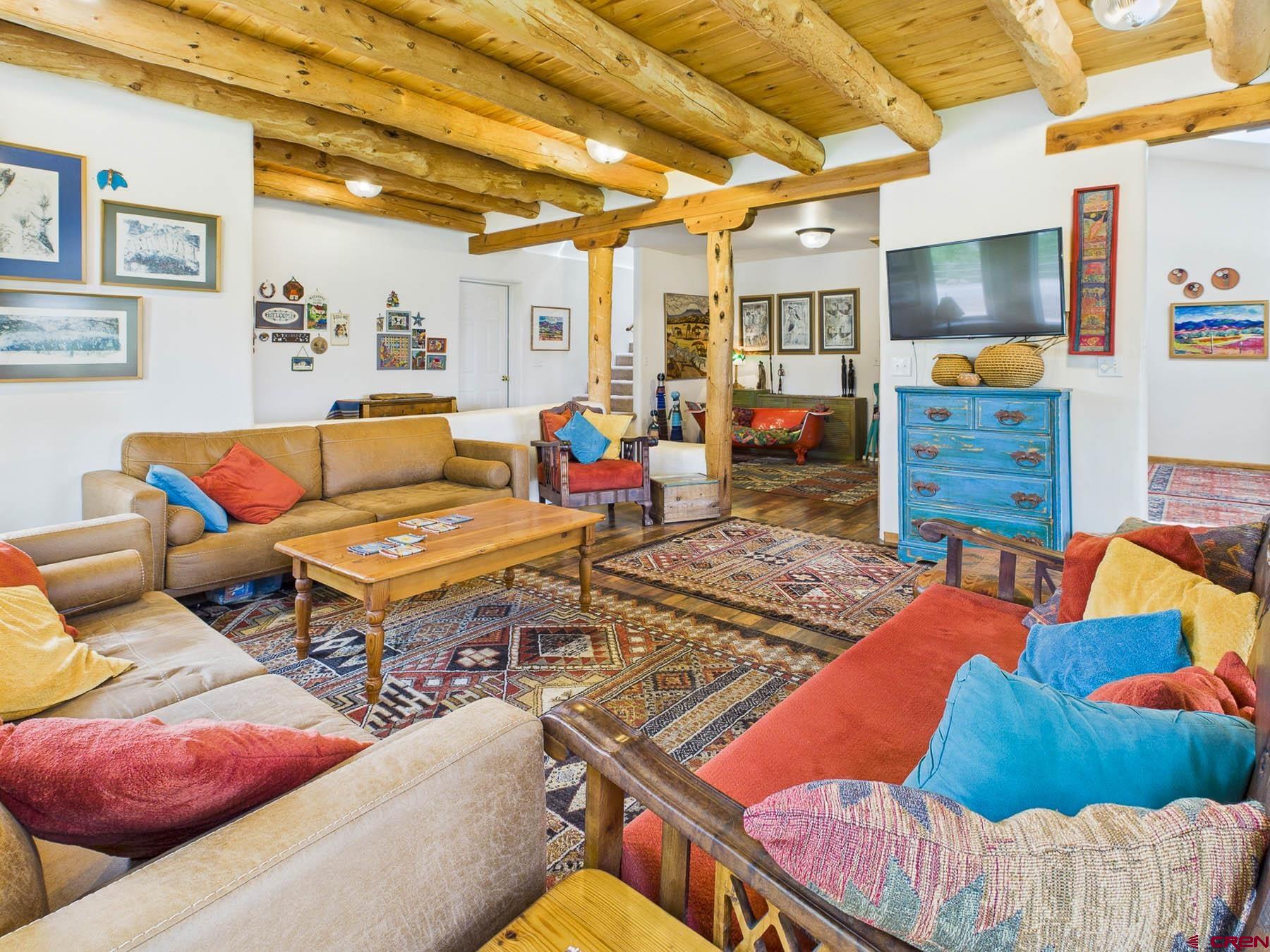 19550 2325th Road Cedaredge, CO 81413 - Photo 11 of 45 a living room with furniture and a flat screen tv