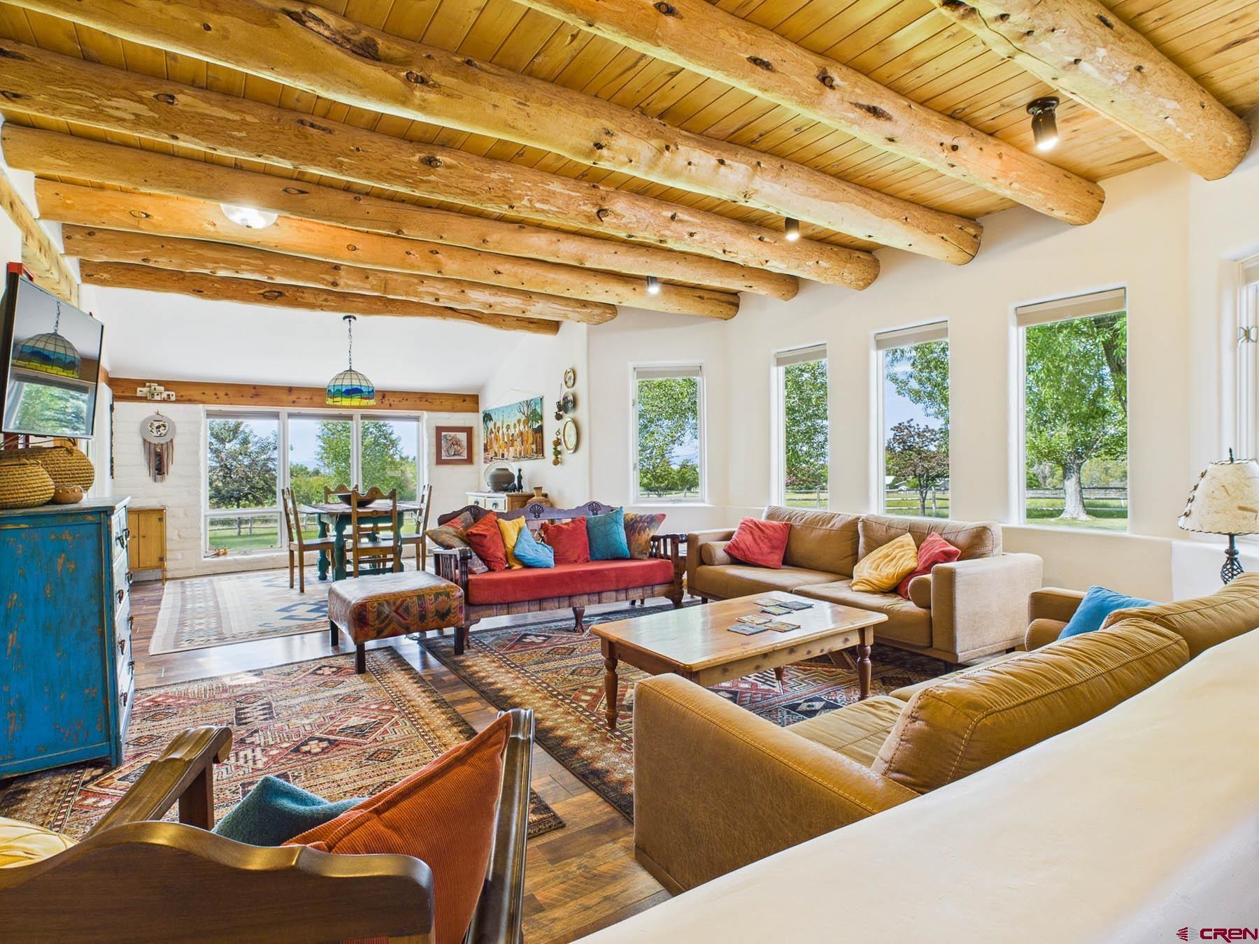 19550 2325th Road Cedaredge, CO 81413 - Photo 12 of 45 a living room with furniture and a large window