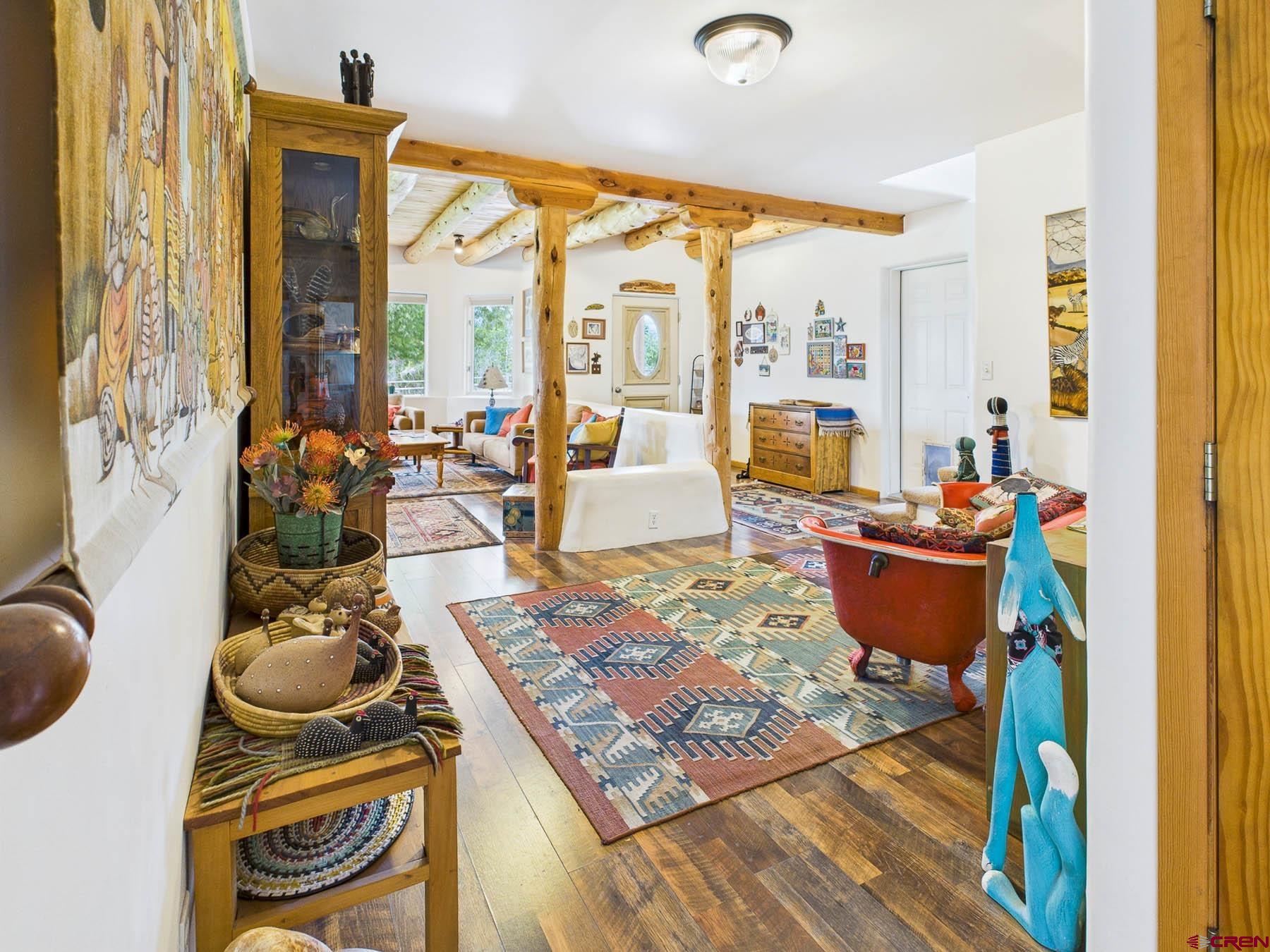 19550 2325th Road Cedaredge, CO 81413 - Photo 18 of 45 a living room with furniture and floor to ceiling windows