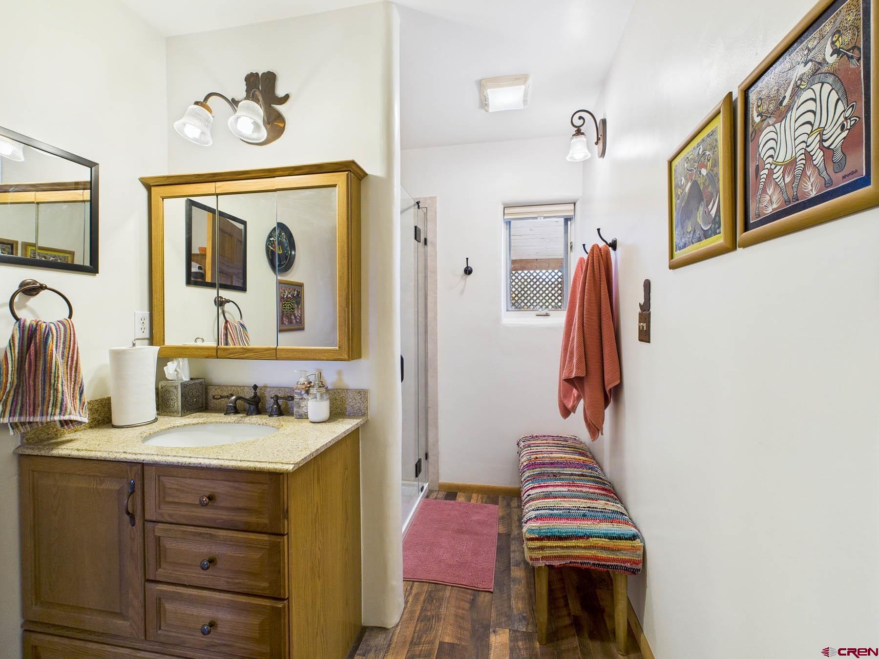 19550 2325th Road Cedaredge, CO 81413 - Photo 19 of 45 a bathroom with a sink a vanity and a mirror