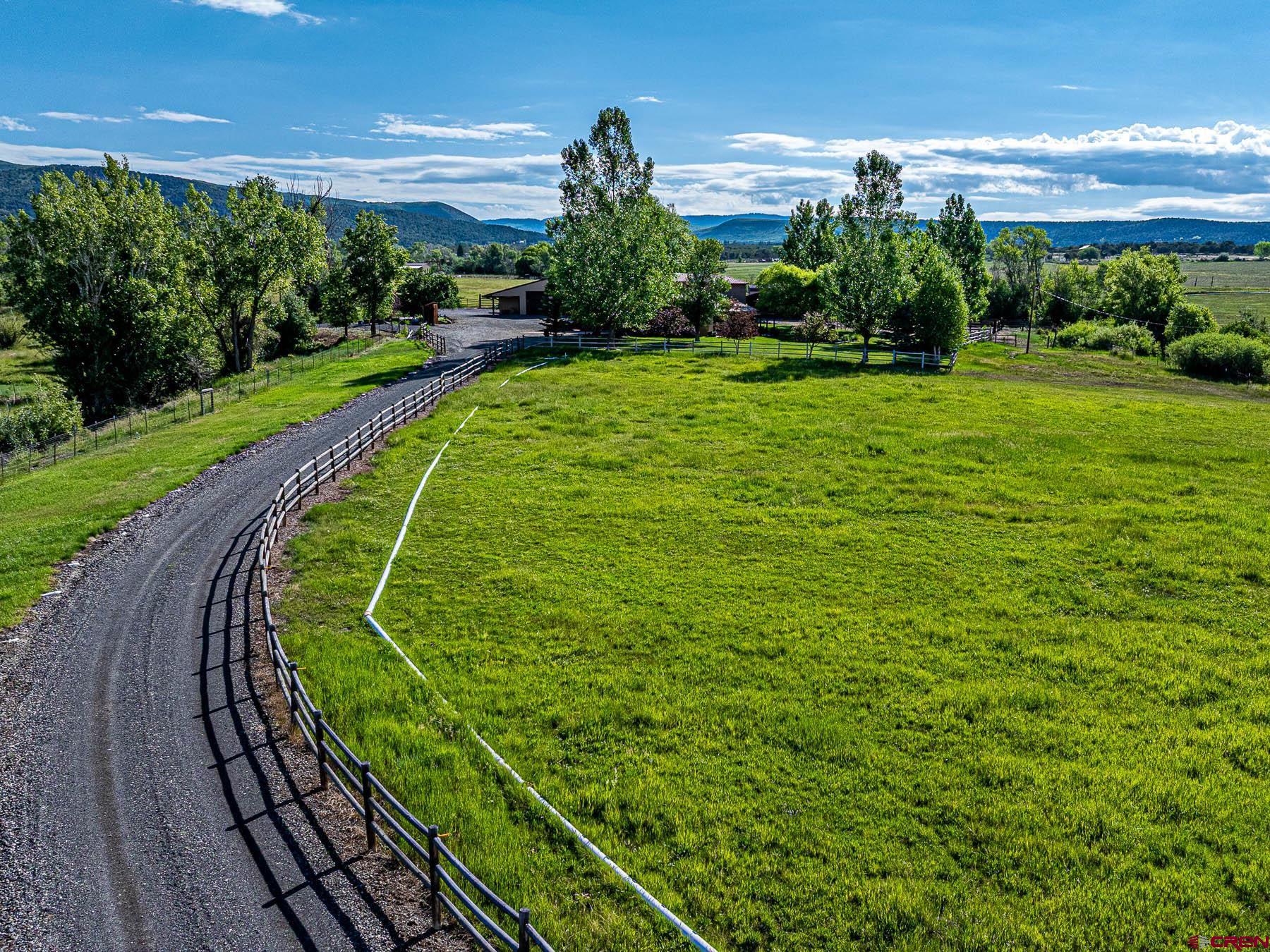 19550 2325th Road Cedaredge, CO 81413 - Photo 2 of 45 a view of a golf course with a swimming pool