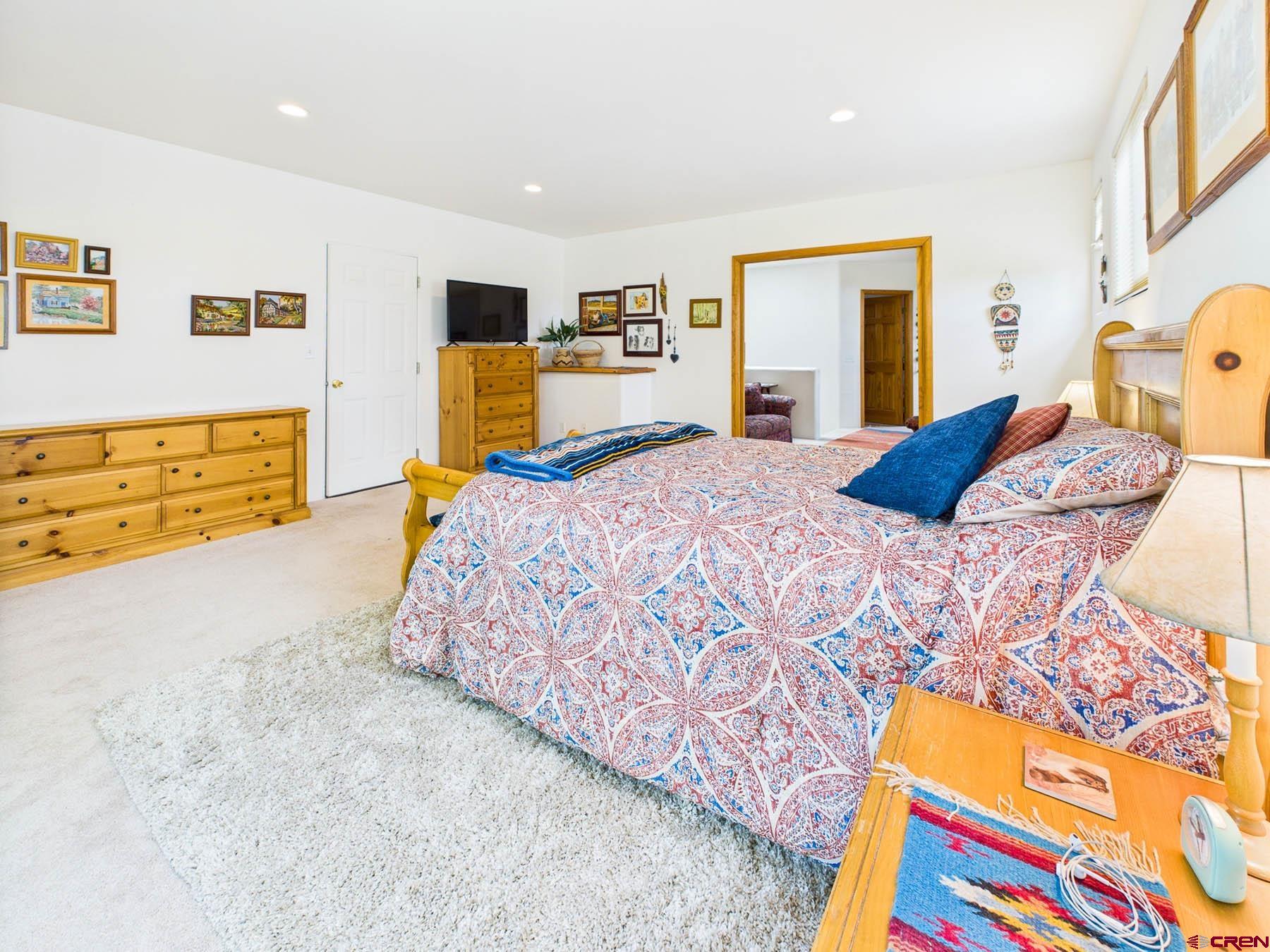 19550 2325th Road Cedaredge, CO 81413 - Photo 24 of 45 a bedroom with a bed and wooden floor
