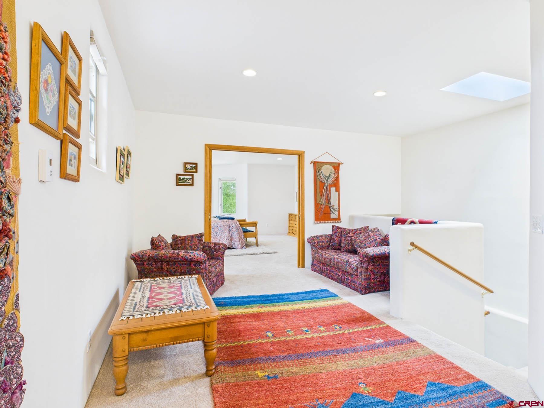 19550 2325th Road Cedaredge, CO 81413 - Photo 25 of 45 a living room with furniture and a rug