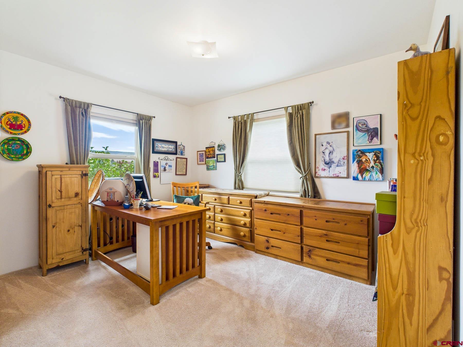 19550 2325th Road Cedaredge, CO 81413 - Photo 28 of 45 a bed room with a bed and a window