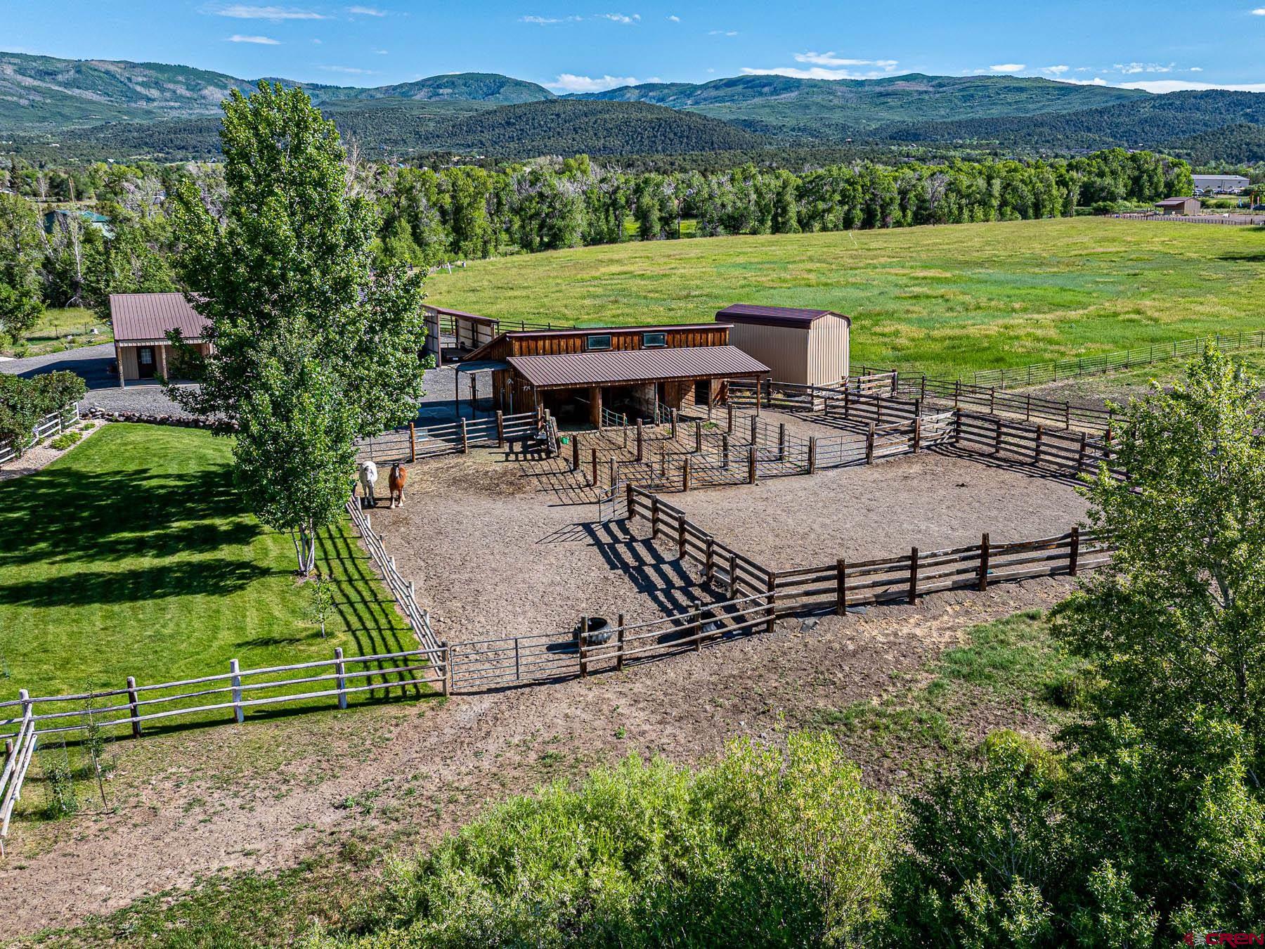 19550 2325th Road Cedaredge, CO 81413 - Photo 29 of 45 an outdoor view of a house with a yard
