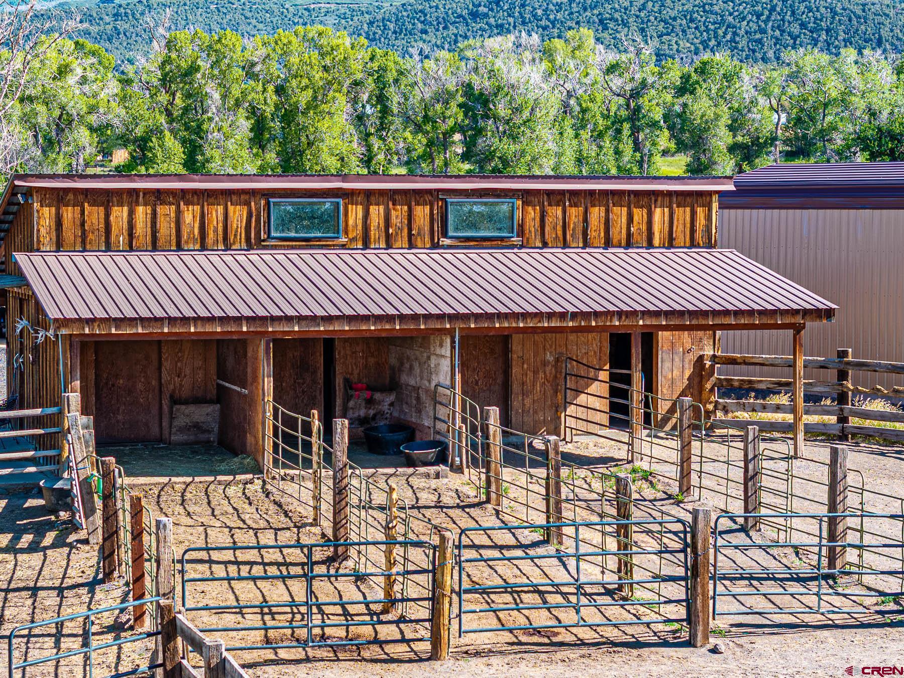 19550 2325th Road Cedaredge, CO 81413 - Photo 32 of 45 a view of a house with porch and wooden floor