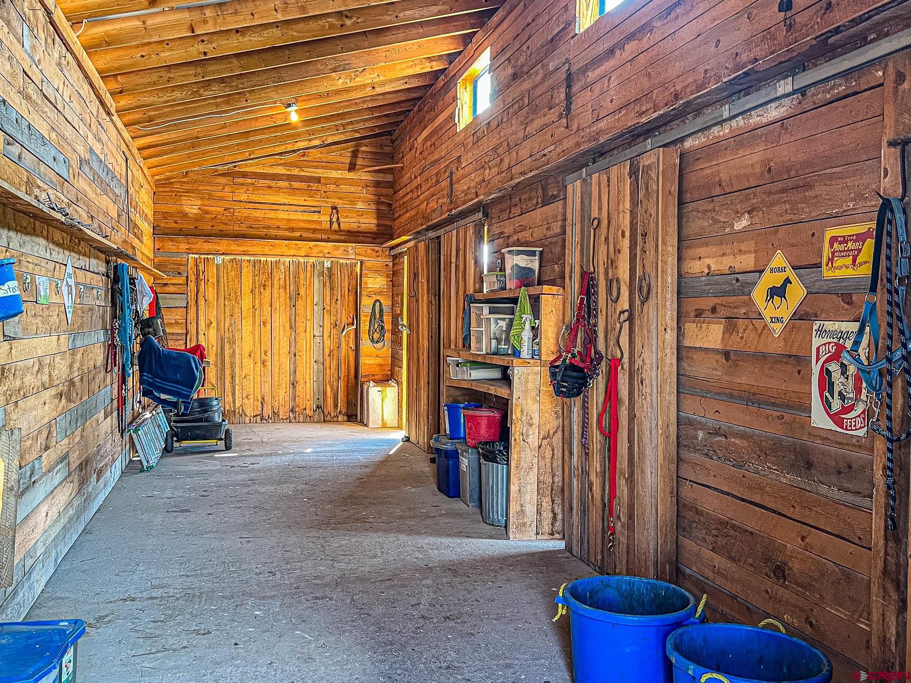 19550 2325th Road Cedaredge, CO 81413 - Photo 36 of 45 a view of an empty room with wooden floor and windows