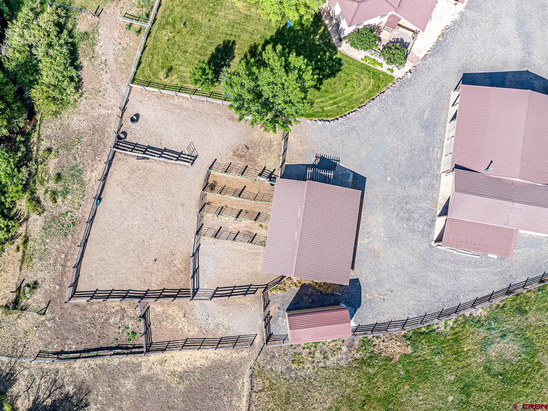 19550 2325th Road Cedaredge, CO 81413 - Photo 39 of 45 an aerial view of a house with a yard and a garage