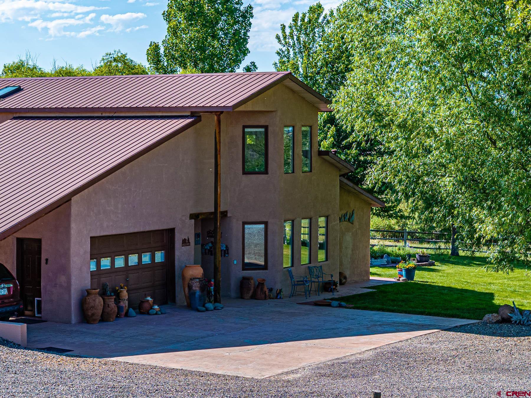 19550 2325th Road Cedaredge, CO 81413 - Photo 4 of 45 a front view of a house with a yard