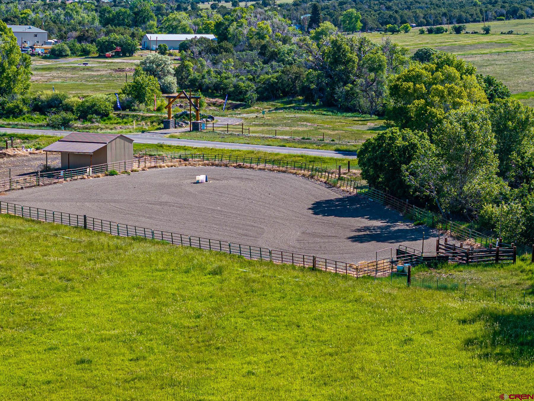 19550 2325th Road Cedaredge, CO 81413 - Photo 41 of 45 a view of a swimming pool with a patio and a yard