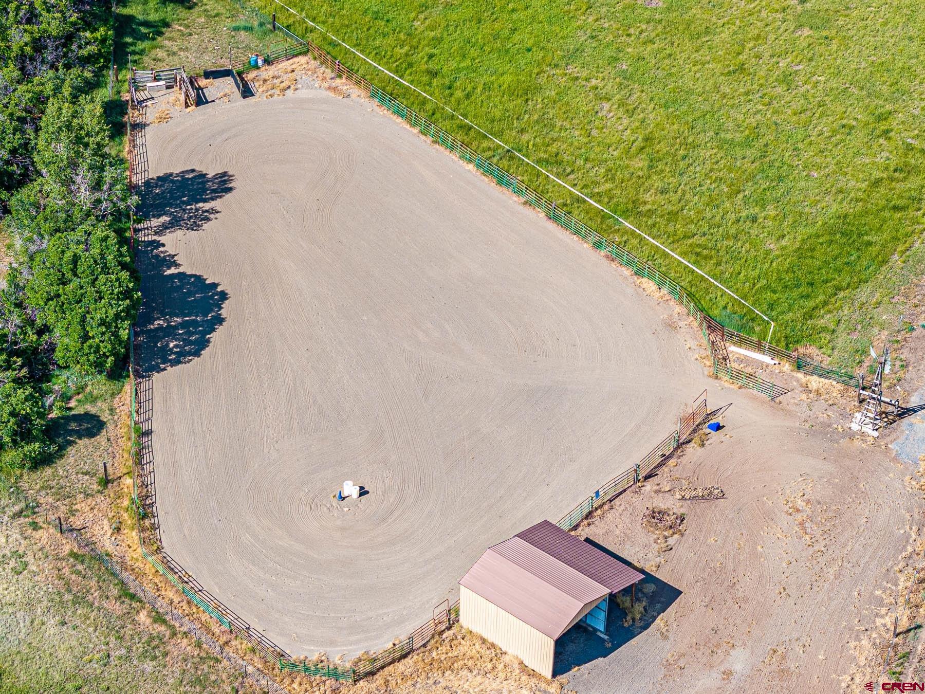 19550 2325th Road Cedaredge, CO 81413 - Photo 42 of 45 an aerial view of a house with a yard and lake view