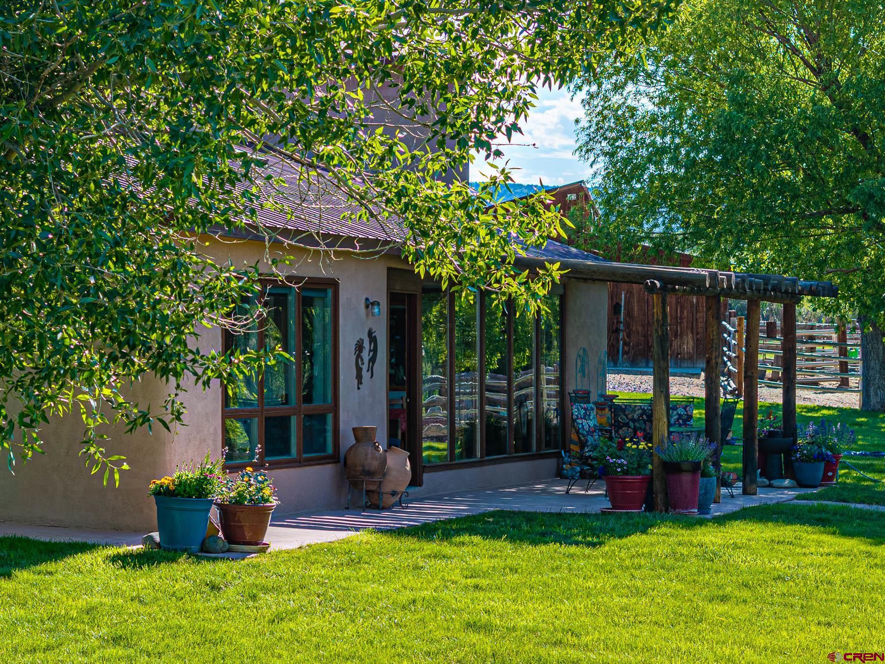 19550 2325th Road Cedaredge, CO 81413 - Photo 5 of 45 a view of a house with backyard and porch