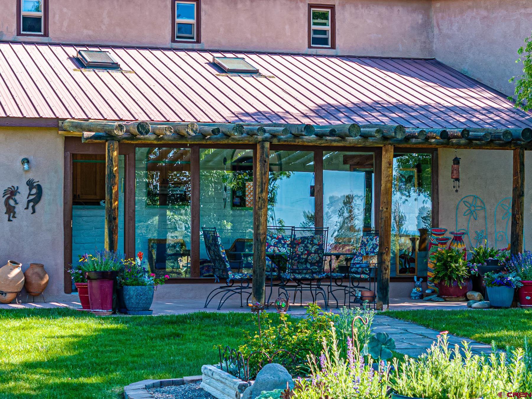 19550 2325th Road Cedaredge, CO 81413 - Photo 6 of 45 a front view of a house with garden