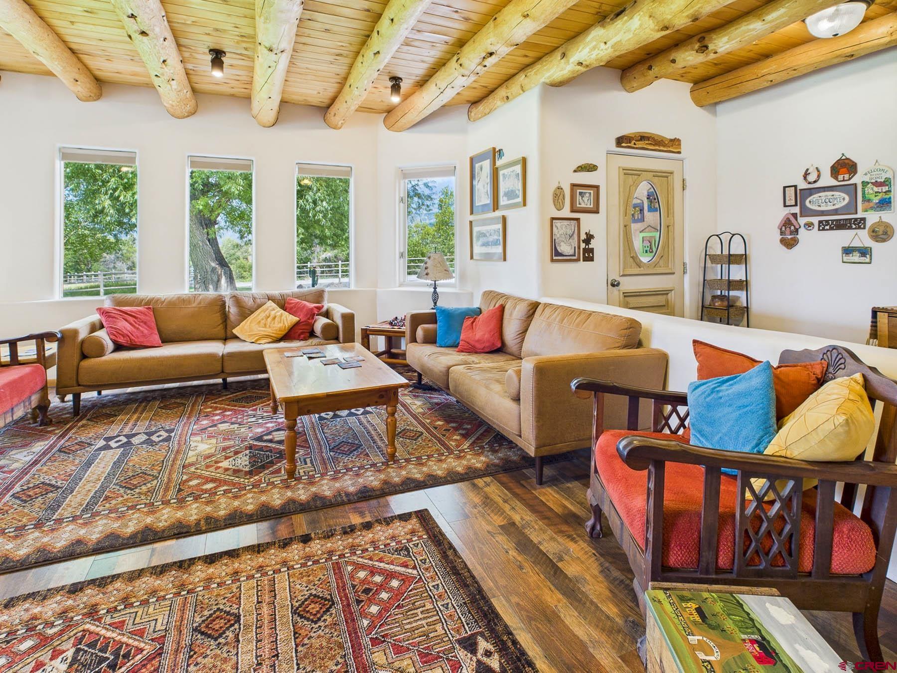 19550 2325th Road Cedaredge, CO 81413 - Photo 10 of 45 a living room with furniture rug and window