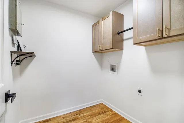 a view of a livingroom with wooden floor