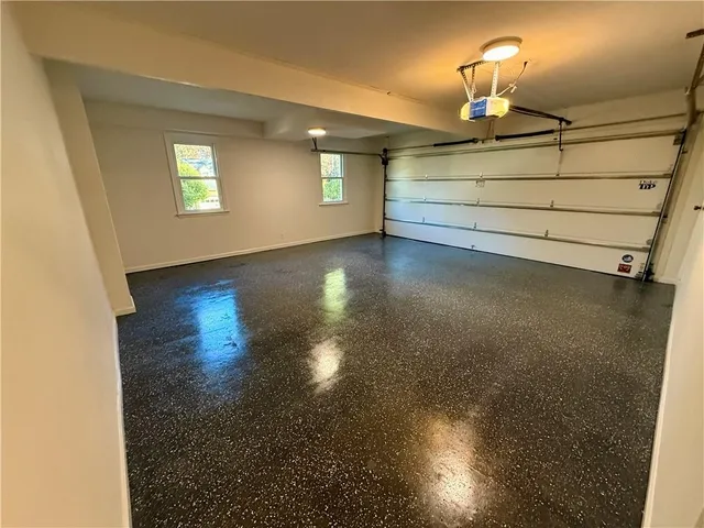 a view of a room with gym equipment and a window