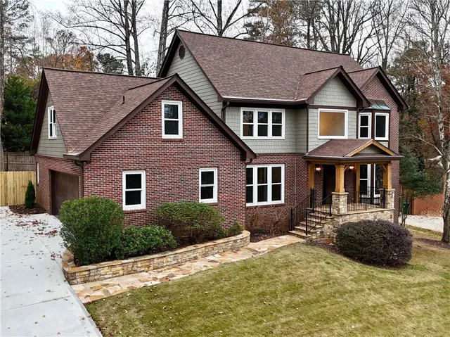 a front view of a house with garden