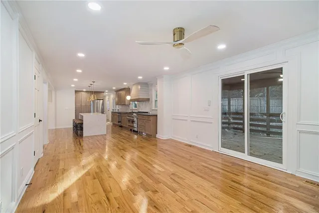 a view of a kitchen with a sink and cabinets