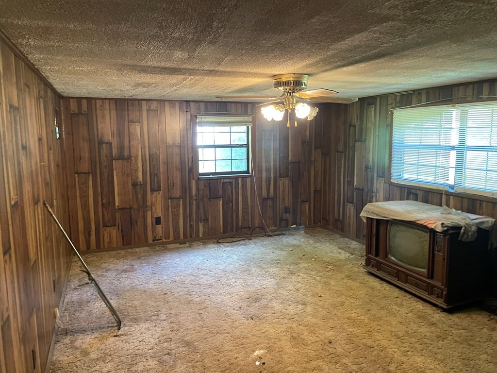 3149 Mutton Hollow Road Kodak, TN 37764 - Photo 13 of 16 a view of an empty room with a fireplace and a window