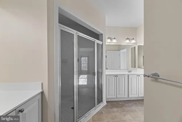 a view of a bathroom with mirror