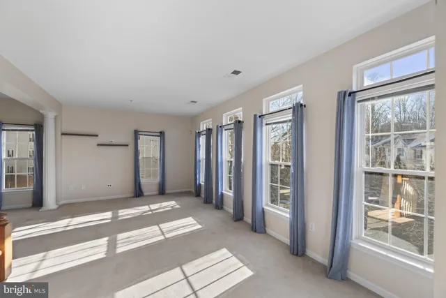 a view of a room with a large window