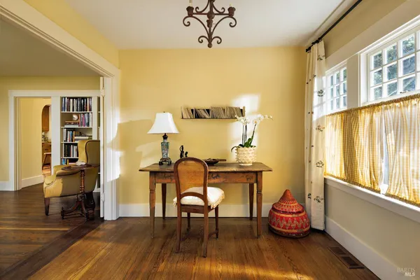 a view of a livingroom with furniture and a window