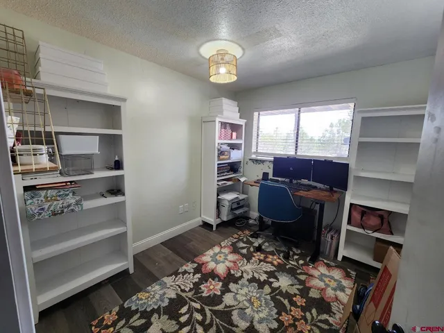 a view of washer and dryer with wooden floor
