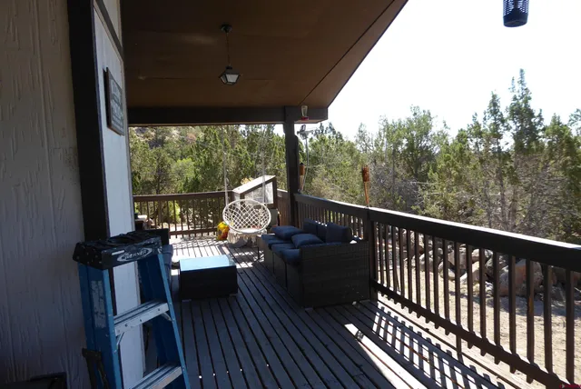 a view of balcony with furniture